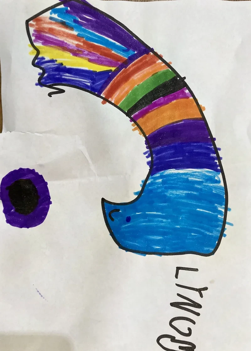 Rainbow arc over blue wave